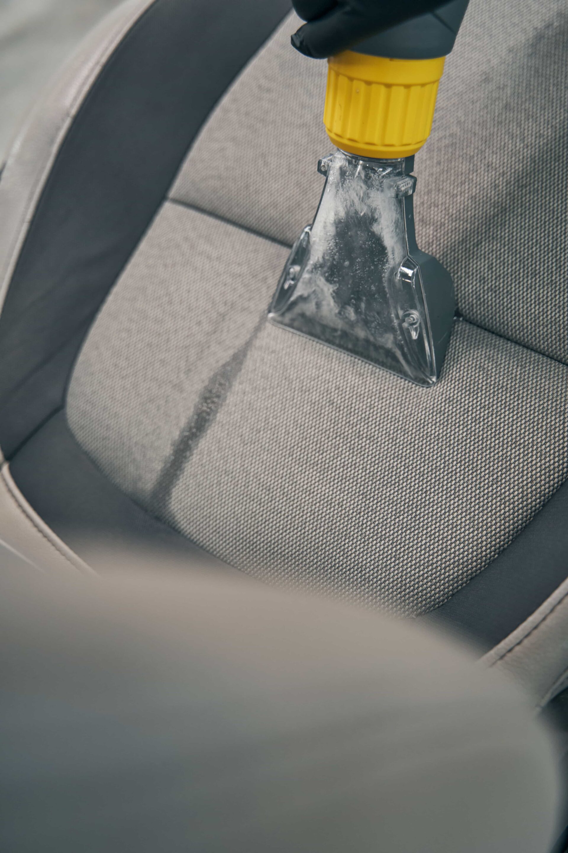 specialist-vacuums-removed-front-seat-at-car-servi-2024-10-18-09-49-17-utc